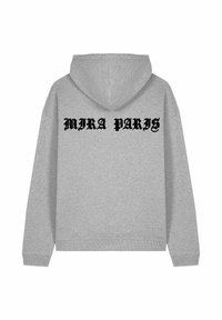 Felpa grigia con cappuccio e maniche lunghe, caratterizzata da testo nero "MIRA PARIS" sulla schiena, texture liscia e polsini e orlo a coste.