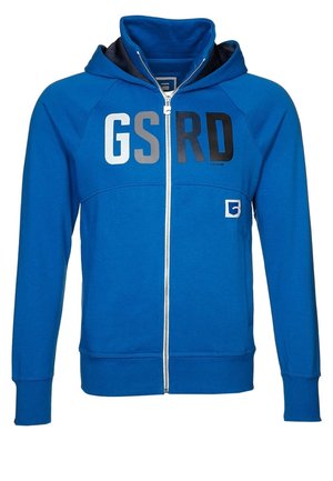 Blauwe hoodie met ritssluiting, met de letters GSRD in wit, grijs en zwart over de borst en een klein vierkant logo aan de linkerkant.