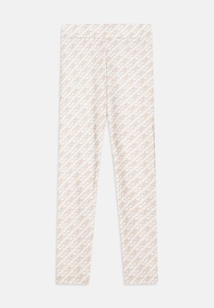 Leggings di un leggero colore beige con un motivo a caratteri diagonali su tutta superficie. Realizzati in un materiale elastico e confortevole.