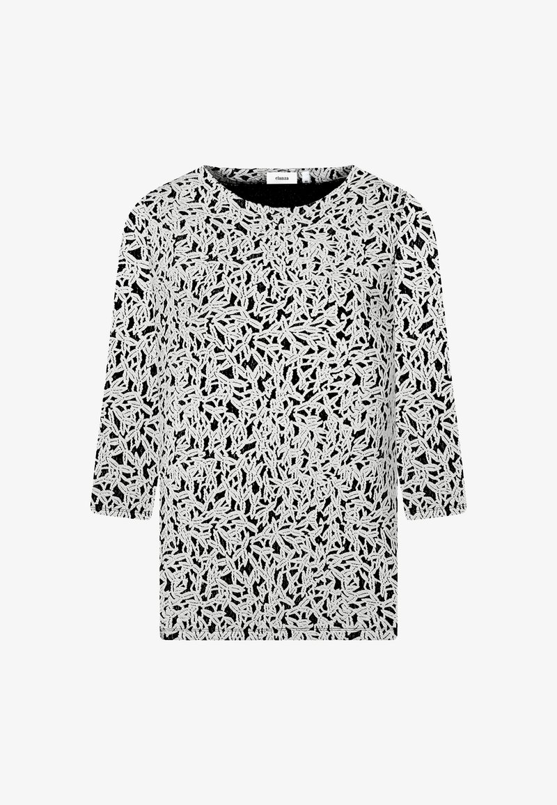 Schwarzes Oberteil mit intricatem weißen Blattmuster, rundem Ausschnitt und dreiviertellangen Ärmeln. Der Stoff wirkt leicht und hat eine strukturierte Oberfläche.