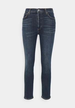 Tummansiniset slim-fit-farkut, joissa on viisi taskua, vyölenkit sekä edessä napillinen ja vetoketjullinen suljin.