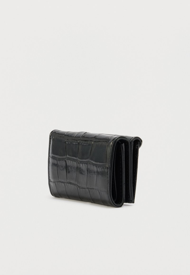 Black folded wallet with glossy crocodile texture, shown closed and standing on a white surface.