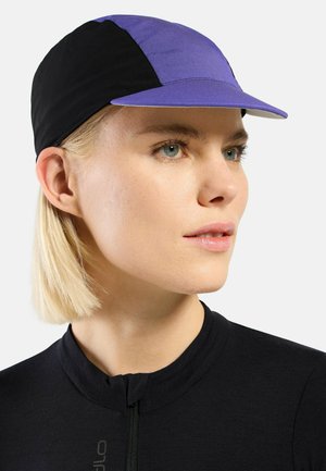 A cycling cap featuring a blue front panel and black sides, made of lightweight fabric with a curved bill and a snug fit.