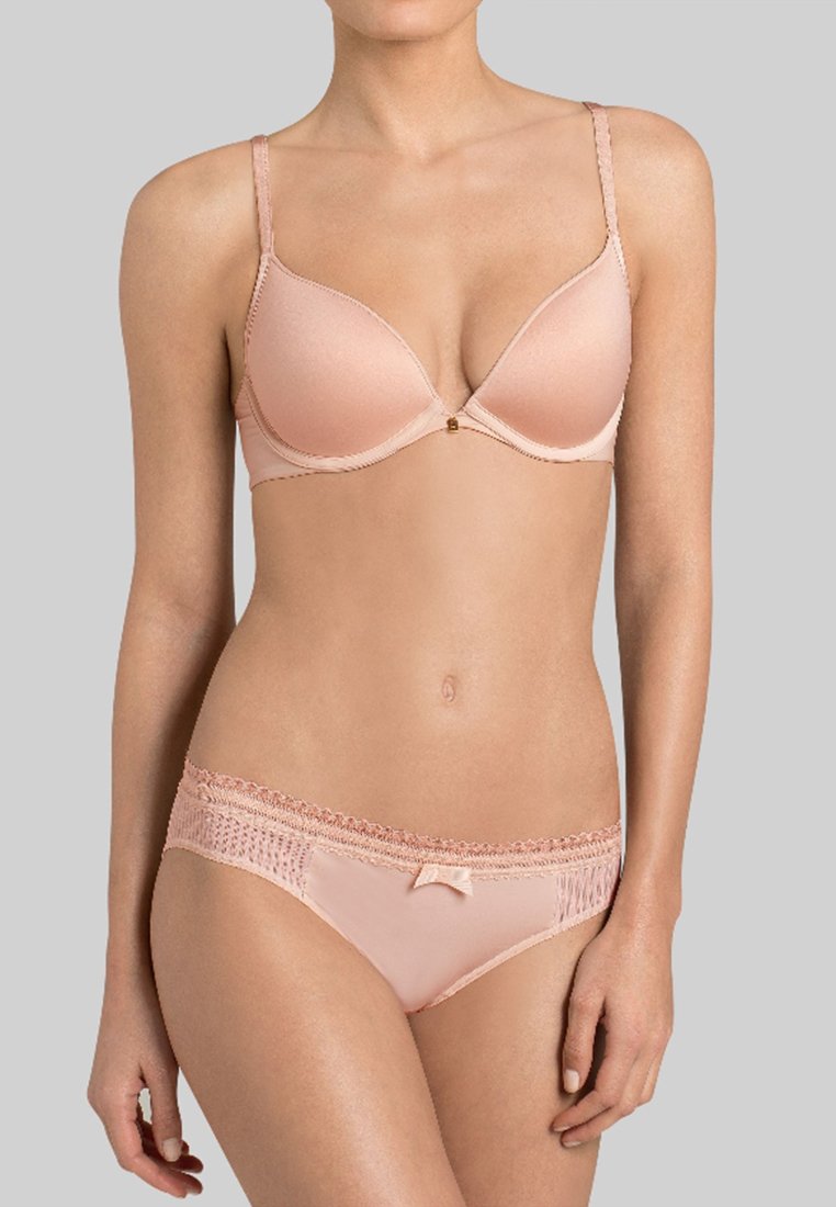 Padded peach bra with a lace trim, adjustable straps, and a central decorative detail; matching low-rise brief with lace accents.
