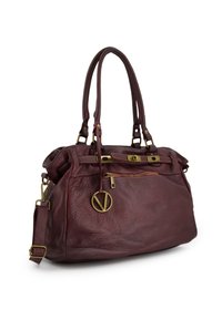 Maroon leather bag with two handles and an adjustable shoulder strap, featuring gold hardware, a zip pocket, and a decorative pendant.
