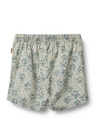 Shorts pour enfants de couleur beige clair avec une taille élastique et un imprimé floral et de feuilles bleues.