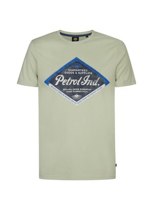 Lys grøn bomulds t-shirt med korte ærmer, udstyret med en blå diamantformet grafik med hvid tekst og et vintage design.