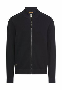 Granatowy kardigan na zamek z fakturowanym wzorem dzianiny, wysokim kołnierzem, prążkowanymi mankietami i obrębem, z małą naszywką z logo po boku.