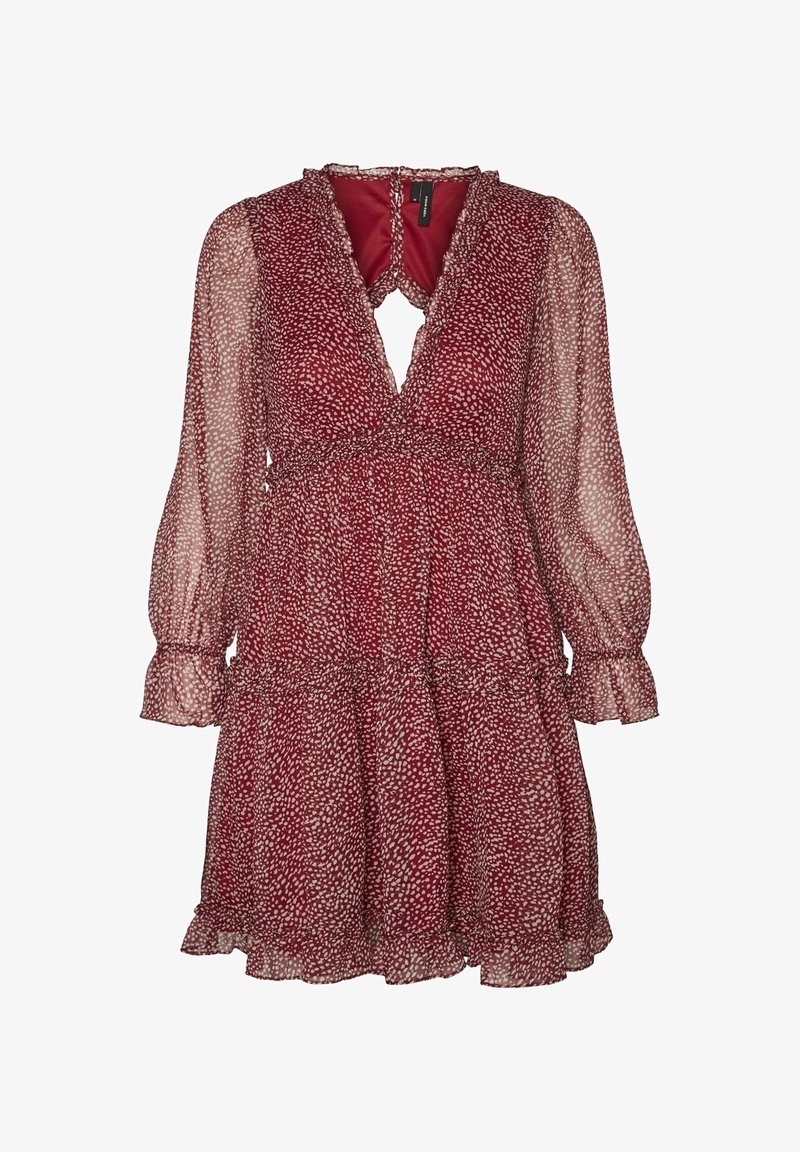 Robe rouge à pois blancs abstraits, manches longues transparentes bouffantes, col en V, ourlet volanté et taille froncée.