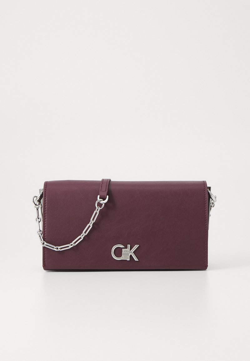 Calvin Klein CONVERTIBLE MINI BAG - Cross body bag - vineyard wine