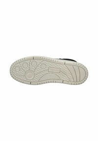 Witte rubberen schoenzool met gestructureerde patronen, ronde grip en een rond logo met groeven voor tweeïgheid en flexibiliteit.