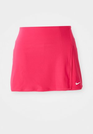 Roze sportrok met een gladde textuur, voorzien van een wit Nike-logo rechtsonder en een getailleerd ontwerp.