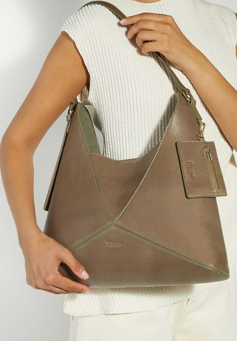 Brown leather shoulder bag with a triangular design, featuring contrasting stitching and a detachable card holder. Smooth texture, matte finish.