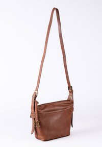 Brown leather shoulder bag with adjustable strap, zippered top, and exterior pocket. Features gold-tone hardware and a smooth texture.