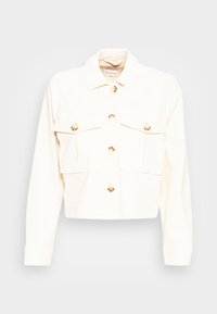 Cropped cream jacket made of denim, featuring a collared neck, two chest pockets, and gold-tone buttons on the front and cuffs.