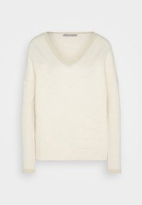 Pull col V à manches longues couleur crème avec une bordure côtelée subtile au niveau de l'encolure et des poignets, étiquette Anna Field.