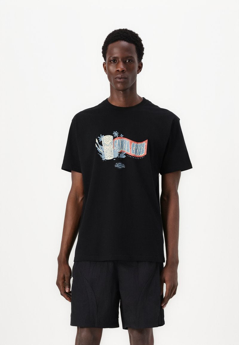 Zwarte katoenen t-shirt met een kleurraf grafiek featuring "Santa Cruz" en tropische motieven. Ronde halslijn en korte mouwen.