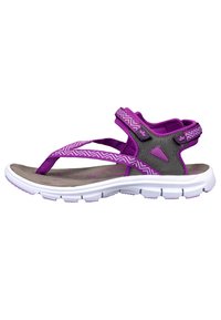 Purple sandals featuring a textile upper with zigzag patterns, a grey heel support, and a textured, cushioned footbed with a white sole.
