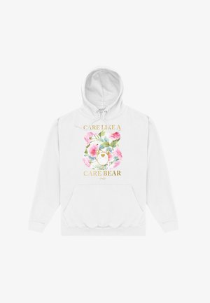 Biała bluza z kapturem z kwiatowym wzorem, przedstawiającą ilustrację misia oraz tekst "TROSKA JAKO MISIE CARE" w złotym kolorze. Z przodu kieszeń typu kangur.