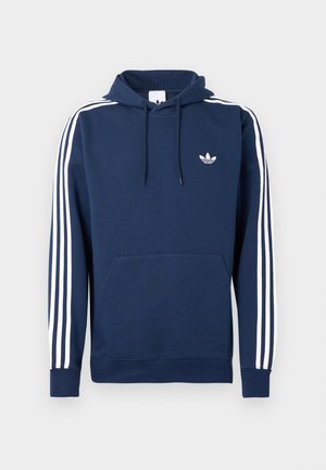 Navy blue hoodie with white three-stripe design on sleeves, front kangaroo pocket, and small white brand logo on chest.