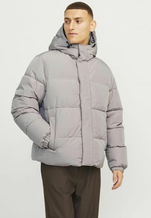 Puffy grey jacket with a hood, featuring elastic cuffs and a zippered front. Material appears soft and insulated. Simple quilted design.