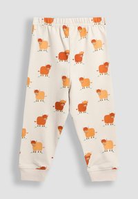 Baumwoll-Mix-Hose mit einem elastischen Bund, versehen mit einem ganzflächigen Muster aus orangefarbenen und hellbraunen Cartoon-Bison auf einem hellen Hintergrund.