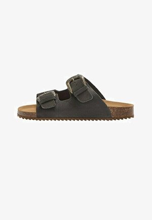 Sort ruskindssandal med to justerbare stropper med spænder, kork-såle og tekstureret gummisål, vist fra siden på en hvid baggrund.