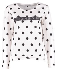 Biała bluza z długim rękawem w czarne kropki, z czarną taśmą z napisem "ALL YOU NEED IS LOVE". Miękka tkanina, okrągły dekolt.