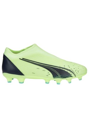 Scarpino da calcio verde lime con tomaia in rete testurizzata, accenti neri e forma aerodinamica. Presenta diversi tacchetti per una buona aderenza.