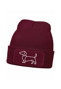 Maroon knit beanie with ribbed texture and a fold-over cuff. Features a white geometric dachshund design on a rectangular patch.