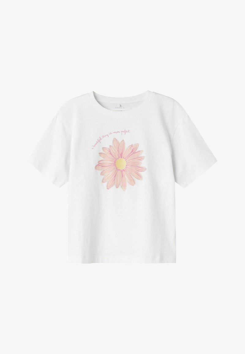 Camiseta de algodón blanca con un gran gráfico de una margarita rosa de centro amarillo. El texto arriba dice: "una cosa hermosa nunca es perfecta."