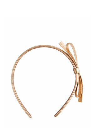 Thin metallic gold headband with a small matching bow on one side, isolated on a white background.