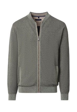 Knit bomber jacket in olive green with a zip front, ribbed cuffs and hem, and side pockets. Features a textured pattern throughout.