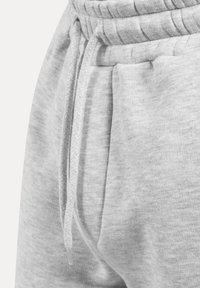 Graue Sweatpants aus strukturiertem Stoff, mit elastischem Bund und Kordelzug-Detail. Verfügt über Seitentaschen für Funktionalität.