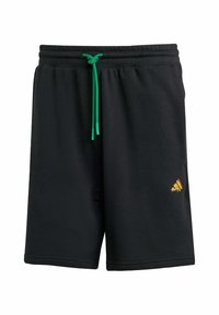 Sorte svedshorts med grøn snor. Har et broderet logo i gul og rød på den nederste venstre del foran. Blødt, afslappet stof.