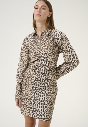Leopard-patterned dress with a zip-front collar, long sleeves, and a cinched waist. Made from textured fabric in neutral tones.