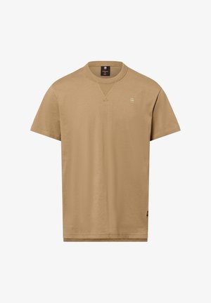 Korte mouwen t-shirt in een lichte tan kleur, gemaakt van soepel stof. Heeft een ronde hals en een klein, geborduurd logo op de borst.