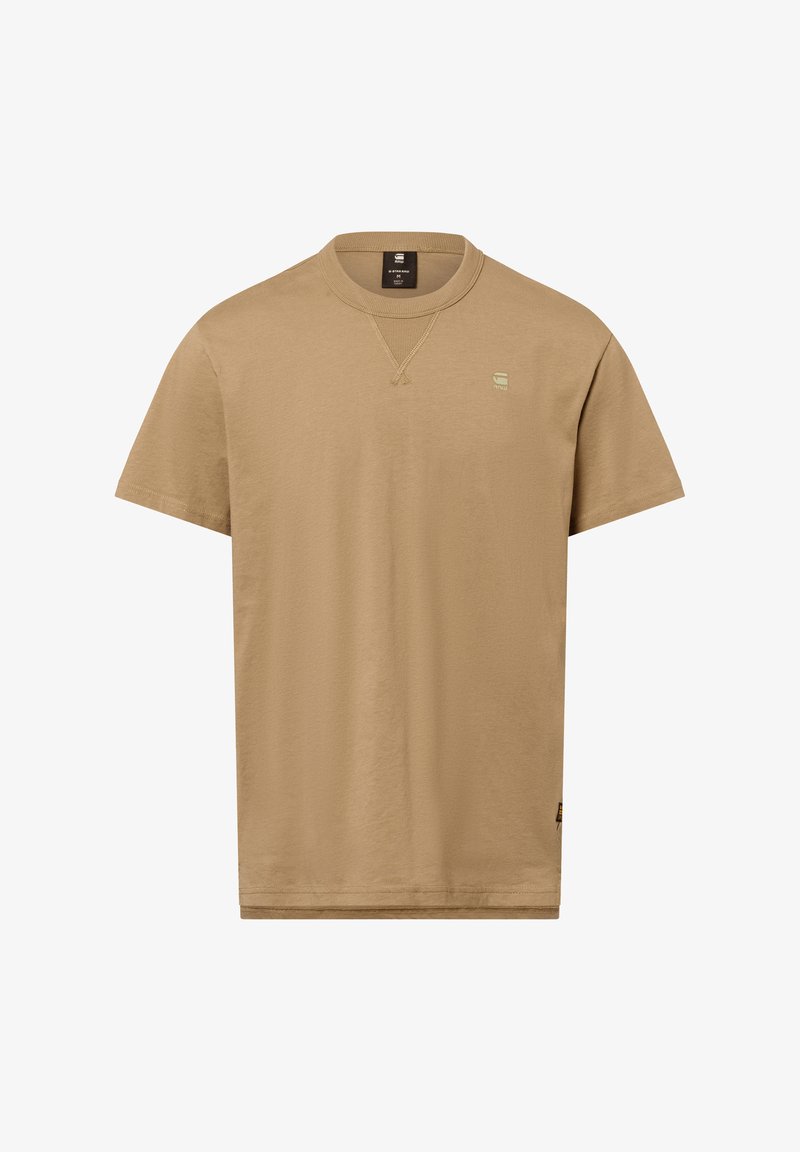 Korte mouwen t-shirt in een lichte tan kleur, gemaakt van soepel stof. Heeft een ronde hals en een klein, geborduurd logo op de borst.