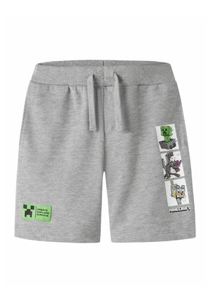 Short gris clair avec cordon, avec des personnages et le logo Minecraft sur la jambe droite, et un patch vert avec du texte sur la jambe gauche.