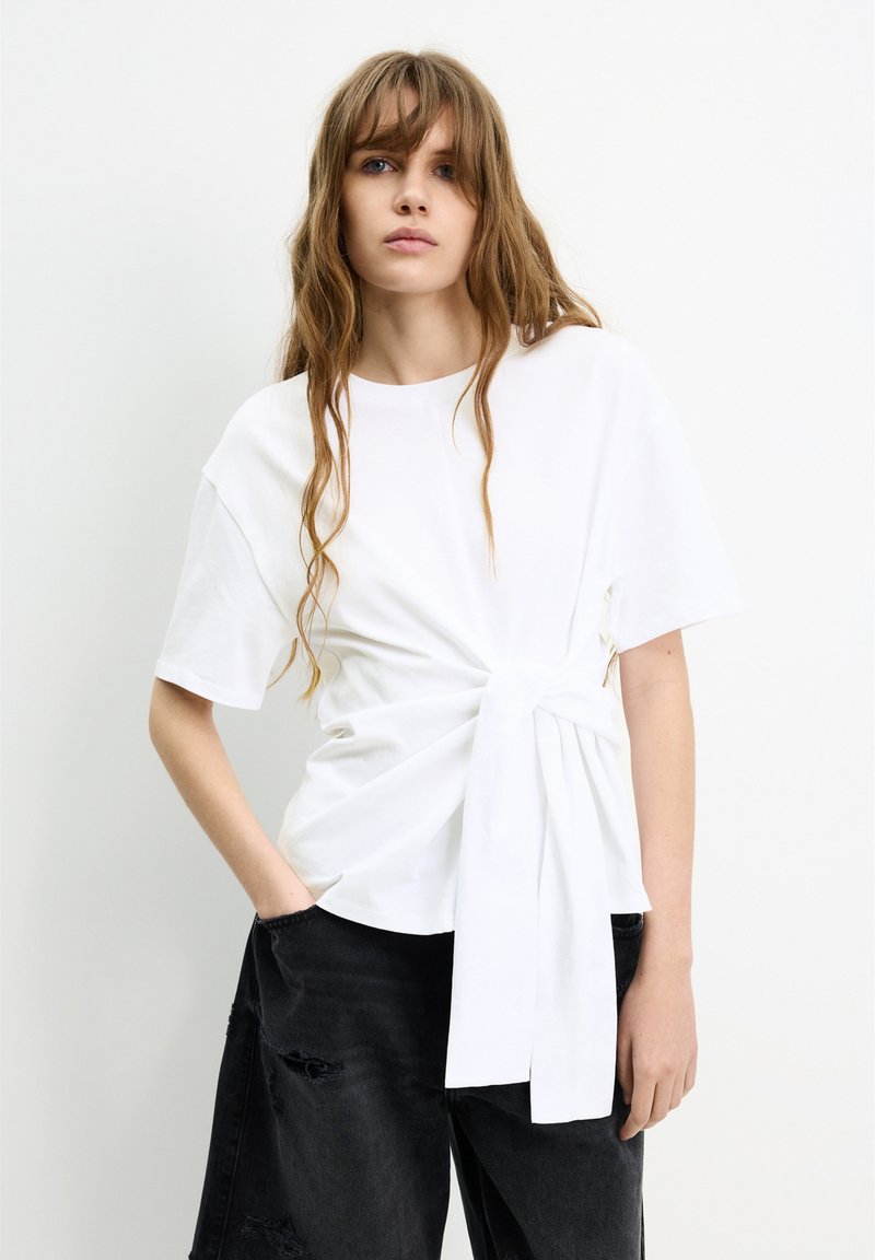 GUESS Originals open knit short sleeve shirt in white/black stripe