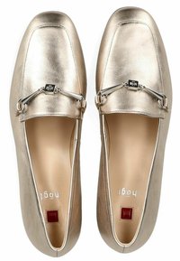 Metallic gold loafers with a smooth texture, rounded toe, silver hardware accent, and a small red square detail on the inside.