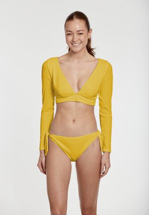 Yellow long-sleeve bikini top with a deep V-neck and gathered front, paired with yellow high-waisted bottoms featuring side ties.
