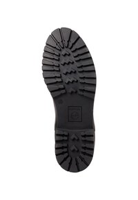 Semelle de botte en caoutchouc noir avec des crampons profonds, un motif en zigzag et une partie lisse près du talon portant une empreinte de logo.