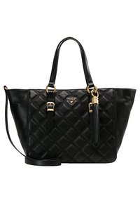 Black quilted handbag made of smooth leather. Features gold hardware and a detachable tassel. Includes two shoulder straps and a removable crossbody strap.