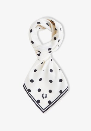 Pañuelo de seda blanco con lunares negros, borde a rayas y logo de corona de laurel en la esquina, doblado en un nudo de lazo.