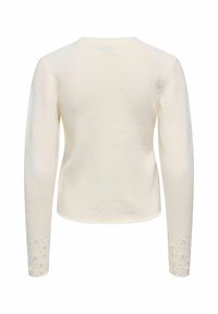 Maglione a maniche lunghe color crema con finitura testurizzata. Scollo rotondo, forma aderente e polsini accentuati con decorazioni in perla.