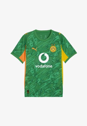 Grünes kurzärmeliges Trikot mit strukturiertem abstraktem Muster, orangefarbigen Akzenten an den Seiten, Rundhalsausschnitt und weißem Vodafone-Logo in der Mitte.