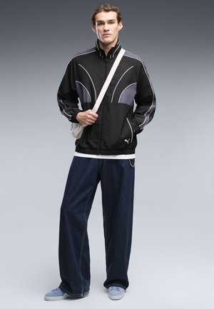 Puma, T7 RELAXED GEWEBTE TRAININGSJACKE - Trainingsvest - black