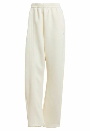 Pantaloni sportivi color crema con vestibilità comoda, vita elastica e strisce laterali. Texture liscia, senza motivi o accessori visibili.