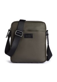 Borsa a tracolla rettangolare verde oliva realizzata in materiale testurizzato, con una tracolla nera regolabile, chiusura con zip e una tasca frontale con accento del logo.